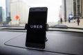 Chicago,IL,USA,Feb-21,2017,Smartphone attached to a car mount in car with Uber logo for editorial use only Royalty Free Stock Photo