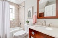 A small full bathroom with a redwood vanity. Royalty Free Stock Photo