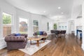 A large sitting area looking towards the kitchen and dining room. Royalty Free Stock Photo