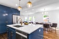 A white and blue luxurious kitchen.