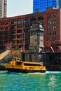 Morning over the Chicago River with view of LaSalle Street bridge as Water Taxi carrying commuters and tourists travels across the