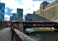 View from Wacker Drive as Purple Line elevated `el` train crosses Wells Street`s elevated track over the Chicago River Royalty Free Stock Photo