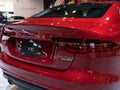 Closeup of the back of a red Jaguar XE displayed at the Chicago Auto Show