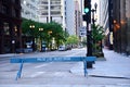 Blue wooden police barricade on street.