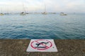 Chicago, Illinois, U.S - October 13, 2018 - `No swimming` sign across from the sailboats on the Lake Michigan Royalty Free Stock Photo