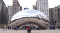 CHICAGO, ILLINOIS, UNITED STATES - DEC 12th, 2015: The skyline of Chicago through the famous monument Cloud Gate in the Royalty Free Stock Photo