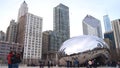 CHICAGO, ILLINOIS, UNITED STATES - DEC 12th, 2015: The skyline of Chicago through the famous monument Cloud Gate in the Royalty Free Stock Photo