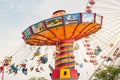 The rotating chair swing ride carousel with people in the Navy Pier park