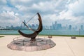 Sundial sculpture, is named is Man Enters the Cosmos with lake Michigan and Chicago skyline on background. Royalty Free Stock Photo