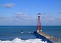 Chicago lighthouse juts out into a frozen Lake Michigan on a freezing winter day in January. Royalty Free Stock Photo