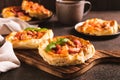Chicago pizza pot pie with sausage, tomatoes and cheese on a board on the table Royalty Free Stock Photo