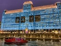 Chicago police tugboat on Chicago River view at dusk in front of building Royalty Free Stock Photo