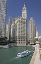 The Chicago River, cruise boat and skyscrapers including Wrigley Building