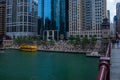 Chicago River recreation with water taxi, business people lunching on riverwalk stairs, couple walking on bridge