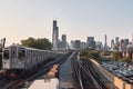 Chicago skyline, cityscape. Train in motion on railway. Taken from chinatown downtown