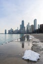 Chicago Skyline Reflected on the Lakefront Trail with Lake Michigan and Ice Royalty Free Stock Photo