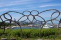 Chicago skyline and 31st St harbor through interlocking butterfly pattern sculpture in Burnham Wildlife Corridor