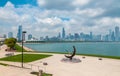 Chicago skyline and Sundial sculpture, is named is Man Enters the Cosmos, located on the plaza of Adler Planetarium, Chicago, USA