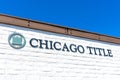 Chicago Title sign on brick wall of Chicago Title Insurance Company office