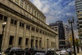 The Chicago Union Station building surrounded by cars parked along the street, skyscrapers and office buildings Royalty Free Stock Photo