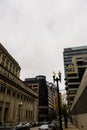 The Chicago Union Station building surrounded by cars parked along the street, skyscrapers and office buildings