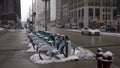 CHICAGO, USA - JANUARY 25, 2021: Divvy Bikes Station and Cars Traffic in Chicago Loop on a Cloudy Winter Day