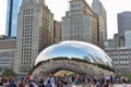 Chicago, USA - June 11, 2018: Cloud Gate - Bean in Millenium Park in summer. Cityscape with tourists on background Royalty Free Stock Photo