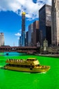 Chicago Water Taxi on a stunningly vibrant dyed-green Chicago River on St. Patrick`s Day