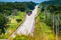 Chicanna, Mexico - November 23, 2010. Wavy road with bus going between forests Royalty Free Stock Photo