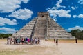 CHICHEN ITZA, MEXICO - FEB 26, 2016: Crowds of tourists visit the Kukulkan pyramid at the archeological site Chichen Itz