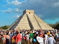 CHICHEN ITZA, MEXICO - MARCH 21,2014: Tourists watching the feathered serpent crawling down the temple Equinox March 21 2014
