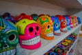 CHICHEN ITZA, MEXICO - NOVEMBER 12, 2017: Close up of colorful Mayan ceramic skulls, a regular motif in the ancient