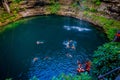 CHICHEN ITZA, MEXICO - NOVEMBER 12, 2017: Unidentified people swimming at Ik-Kil Cenote near Chichen Itza, Mexico. And
