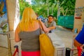 CHICHEN ITZA, MEXICO - NOVEMBER 12, 2017: Unidentified woman giving the tickets to enter and visit at Chichen Itza ruins Royalty Free Stock Photo