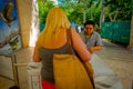 CHICHEN ITZA, MEXICO - NOVEMBER 12, 2017: Unidentified woman giving the tickets to enter and visit at Chichen Itza ruins Royalty Free Stock Photo