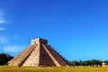 Chichen Itza pyramid on the background of bright blue sky. The most famous archaeological complex of the Maya in Mexico.
