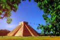 Chichen Itza pyramid on the background of bright blue sky. The most famous archaeological complex of the Maya in Mexico.