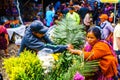 Chichicastenango, Guatemala on 2th May 2016: Indigneous woman with colorful clothes selling flowers on market in Chichicatenango Royalty Free Stock Photo
