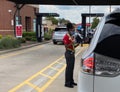 Chick fil A employee wear mask and help customer ordering food