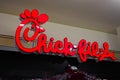 Chick-fil-A fast food restaurant chain logo sign closeup in Ala Moana shopping mall food court.