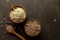 Chick Pea Flour with uncooked chickpea on dark background Royalty Free Stock Photo