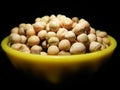 Chick peas or gram or also known as Bengal grams under dark background