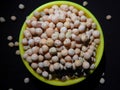 Chick peas or gram or also known as Bengal grams under dark background