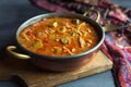 Chicken and Andouille sausage gumbo in a copper pot on a vintage cutting board. Royalty Free Stock Photo