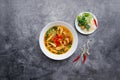 Chicken Bamboo Noodle with green leafs and lime served in bowl isolated on dark grey background top view of japanese food