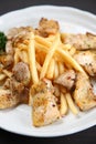 Chicken basil with French fries Royalty Free Stock Photo