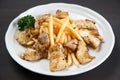 Chicken basil with French fries Royalty Free Stock Photo