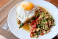 Chicken basil and fried eggs with white rice Royalty Free Stock Photo