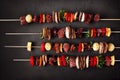 Chicken and beef kebabs on wooden skewers, food photography, generative AI