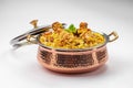 Chicken Biryani in brass serving bowl Royalty Free Stock Photo